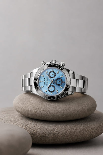 Daytona (Ice Blue Black Bezel) Seiko VK63 meca-quartz chronograph mod watch. A light blue dial watch with a black bezel and metal link bracelet is shown in a full product shot.