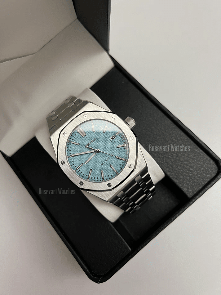 Royal Oak (Light Blue) Seiko NH35 automatic mod watch. A light blue dial watch with a silver bezel and metal bracelet inside a watch box.
