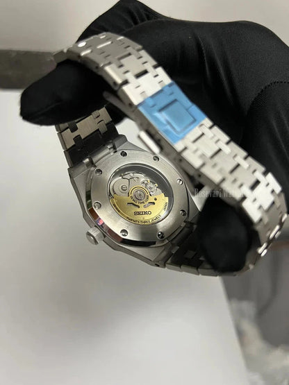 Royal Oak (Light Blue) Seiko NH35 automatic mod watch. The back of a watch showing the mechanical movement and metal bracelet.