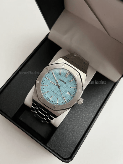 Royal Oak (Light Blue) Seiko NH35 automatic mod watch. A light blue dial watch with a silver bezel and metal bracelet inside a watch box.