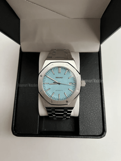 Royal Oak (Light Blue) Seiko NH35 automatic mod watch. A light blue dial watch with a silver bezel and metal bracelet inside a watch box.