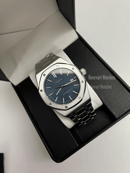 Royal Oak (Blue) Seiko NH35 automatic mod watch. A full watch shot inside a box showing a blue textured dial and silver bezel on a metal link bracelet.