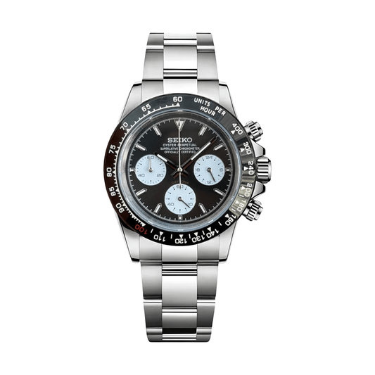 Daytona (Le Mans) Seiko VK63 meca-quartz chronograph mod watch. A black dial watch with a tachymeter bezel and a steel bracelet, shown in a full product shot.