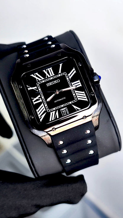 Santos (Black) Seiko NH35 automatic mod watch. A full watch shot showing a black dial with white Roman numerals and a black rubber strap.